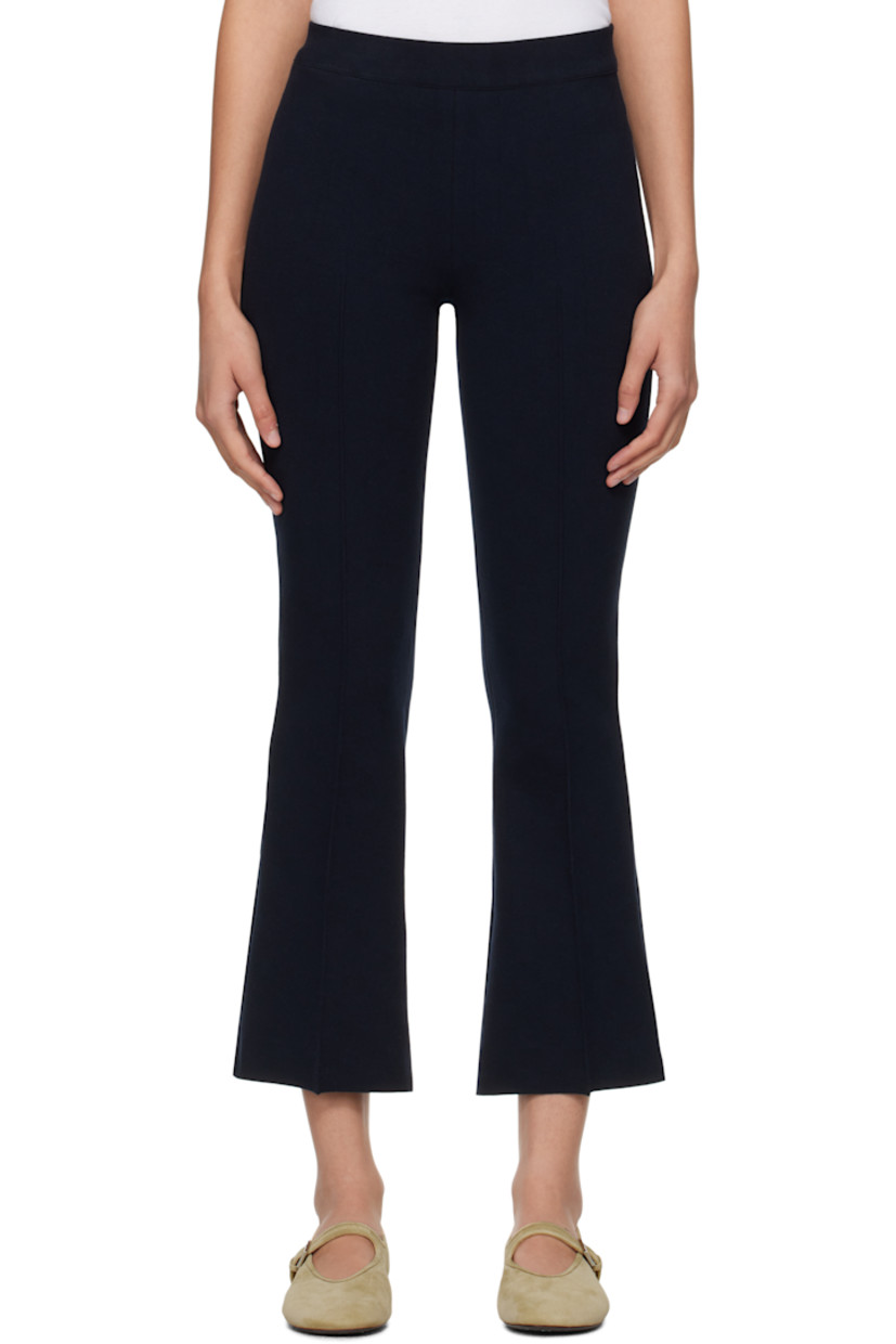 Flared knit stretch cotton-blend trousers. Subtle jacquard check pattern throughout.

· Elasticized waistband
· Pinched seam at cropped legs
· Mock welt pockets at back

Supplier color: Dark navy