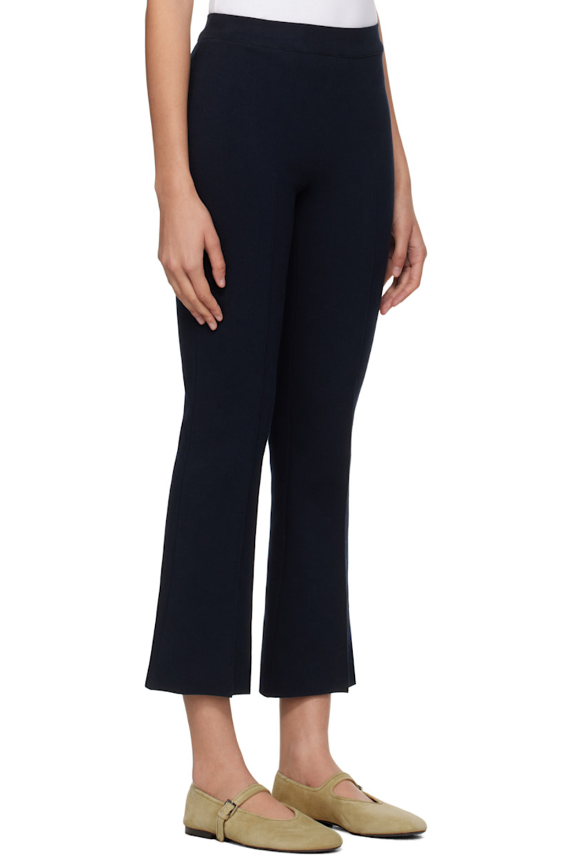 Flared knit stretch cotton-blend trousers. Subtle jacquard check pattern throughout.

· Elasticized waistband
· Pinched seam at cropped legs
· Mock welt pockets at back

Supplier color: Dark navy