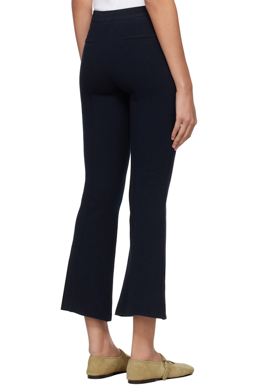 Flared knit stretch cotton-blend trousers. Subtle jacquard check pattern throughout.

· Elasticized waistband
· Pinched seam at cropped legs
· Mock welt pockets at back

Supplier color: Dark navy