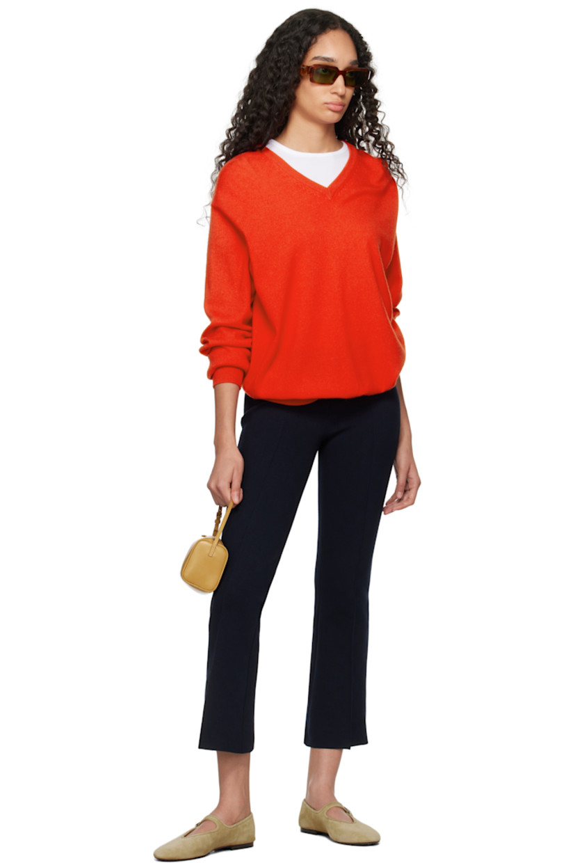 Flared knit stretch cotton-blend trousers. Subtle jacquard check pattern throughout.

· Elasticized waistband
· Pinched seam at cropped legs
· Mock welt pockets at back

Supplier color: Dark navy
