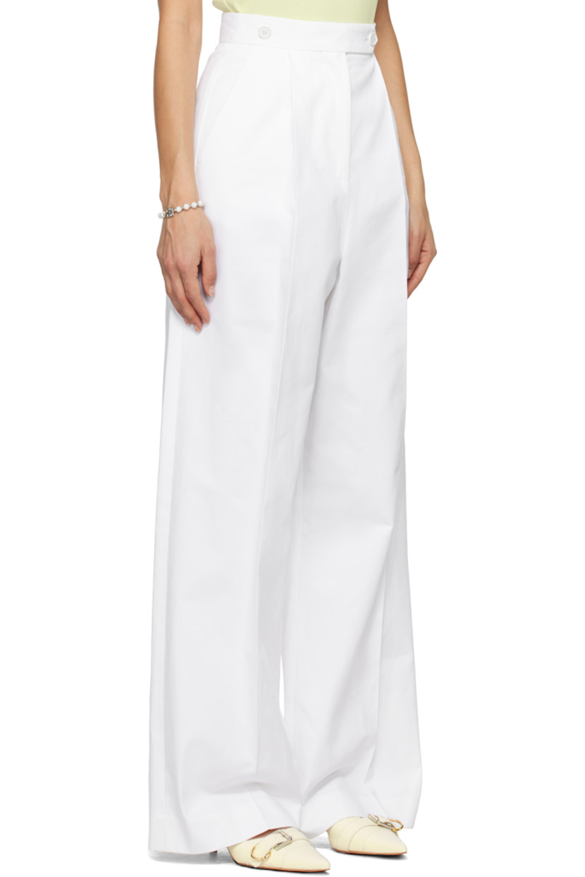 Cotton twill trousers.

· Button tabs at waistband
· Four-pocket styling
· Zip-fly
· Pleats at front
· Logo embroidered at leg
· Creased legs

Supplier color: White