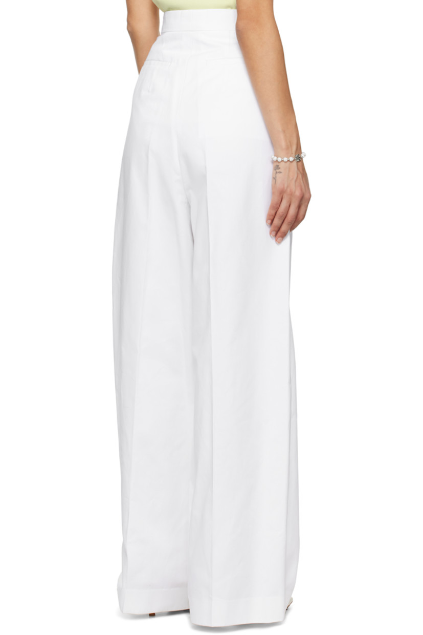 Cotton twill trousers.

· Button tabs at waistband
· Four-pocket styling
· Zip-fly
· Pleats at front
· Logo embroidered at leg
· Creased legs

Supplier color: White