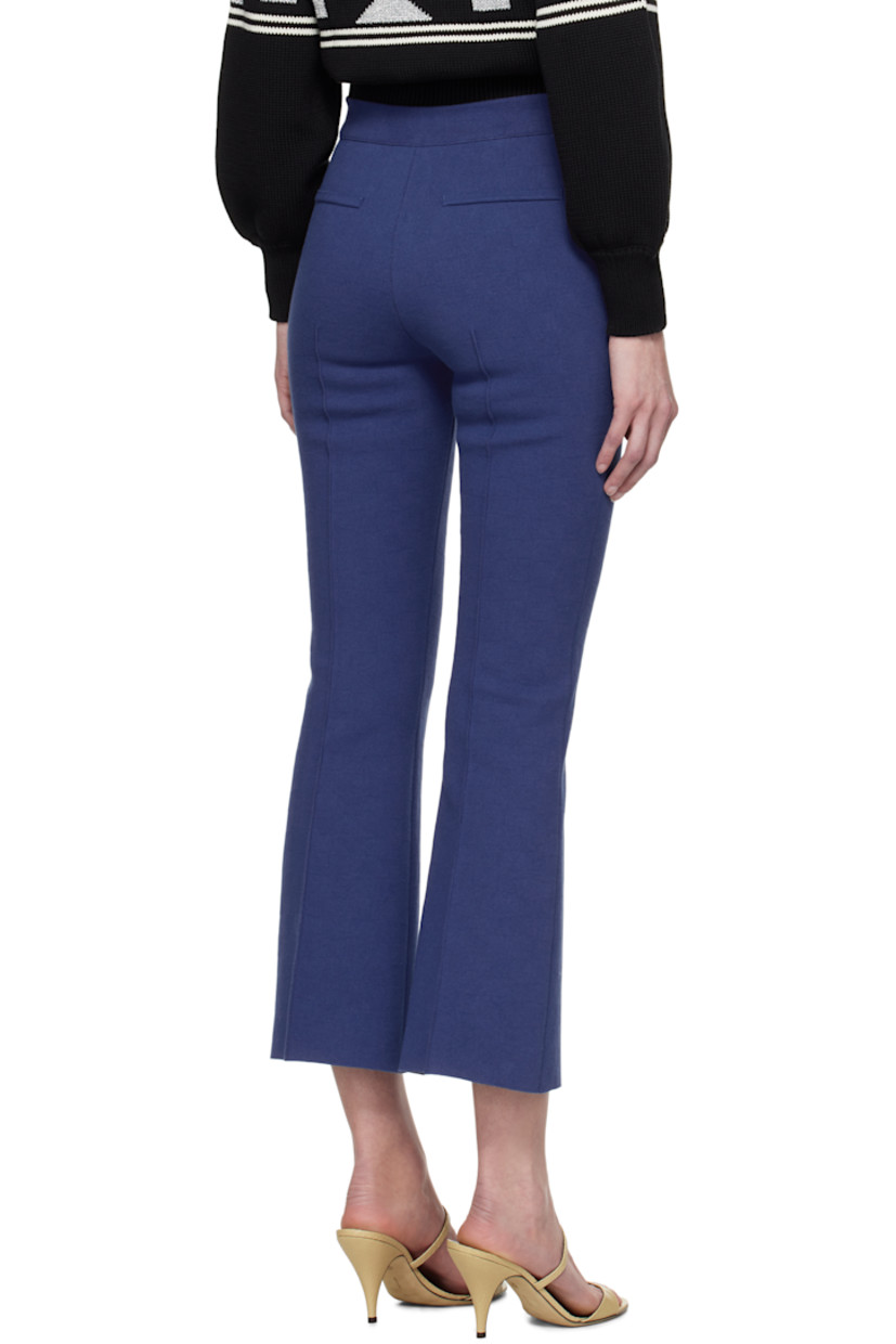 Flared knit stretch cotton-blend trousers. Subtle jacquard check pattern throughout.

· Elasticized waistband
· Pinched seams at front and back
· Cropped cuffs
· Mock welt pockets at back

Supplier color: Royal blue