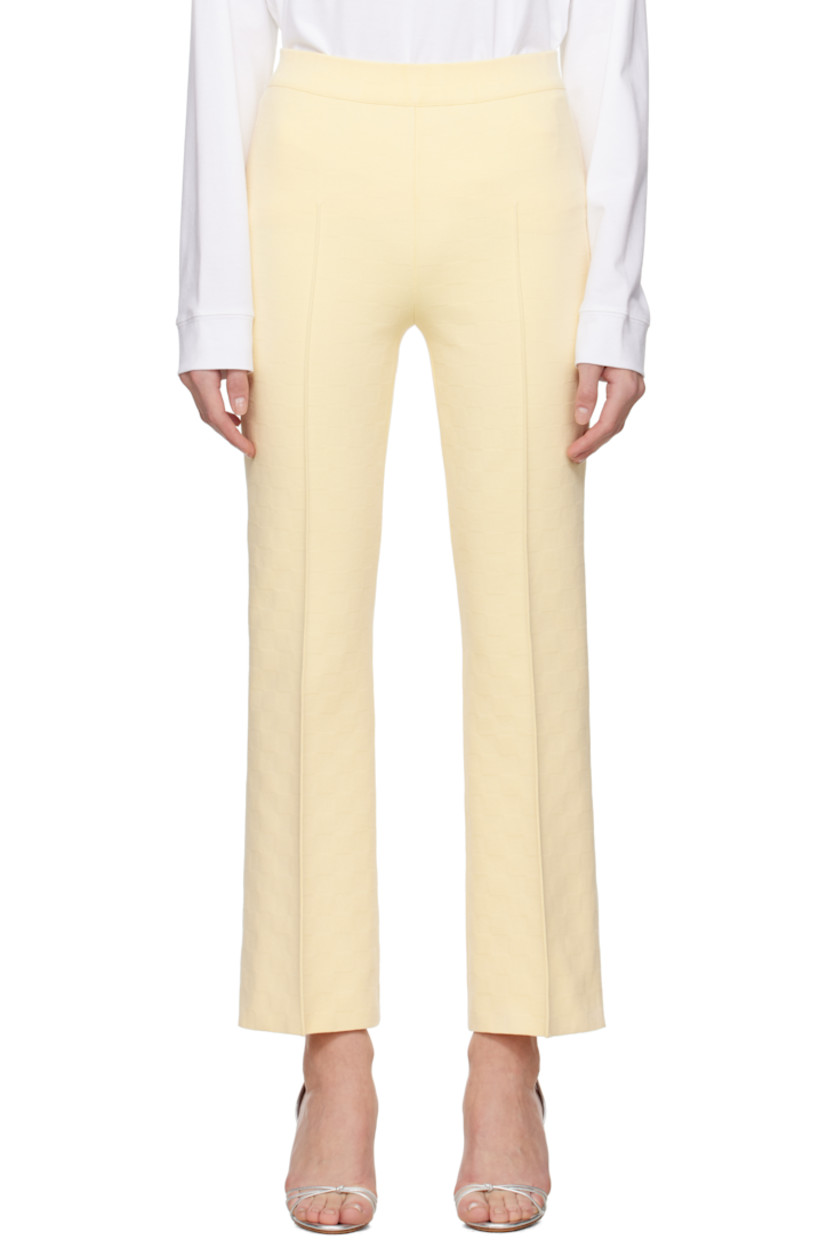 Flared knit stretch cotton-blend trousers. Jacquard check pattern throughout.

· Mid-rise
· Elasticized waistband
· Pinched seam at legs
· Cropped leg
· Mock welt pockets at back

Supplier color: Pale yellow