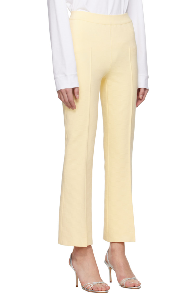 Flared knit stretch cotton-blend trousers. Jacquard check pattern throughout.

· Mid-rise
· Elasticized waistband
· Pinched seam at legs
· Cropped leg
· Mock welt pockets at back

Supplier color: Pale yellow