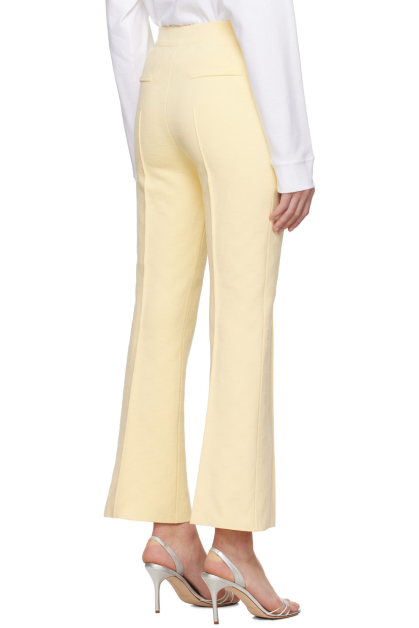 Flared knit stretch cotton-blend trousers. Jacquard check pattern throughout.

· Mid-rise
· Elasticized waistband
· Pinched seam at legs
· Cropped leg
· Mock welt pockets at back

Supplier color: Pale yellow