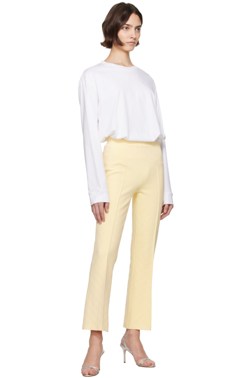 Flared knit stretch cotton-blend trousers. Jacquard check pattern throughout.

· Mid-rise
· Elasticized waistband
· Pinched seam at legs
· Cropped leg
· Mock welt pockets at back

Supplier color: Pale yellow