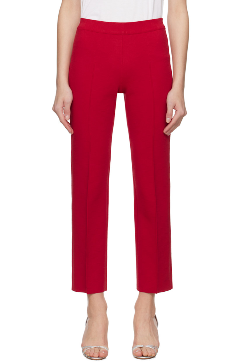 Knit stretch cotton-blend trousers. Jacquard check pattern throughout.

· Elasticized waistband
· Pinched seam at front and back legs
· Mock welt pockets at back

Supplier color: Red