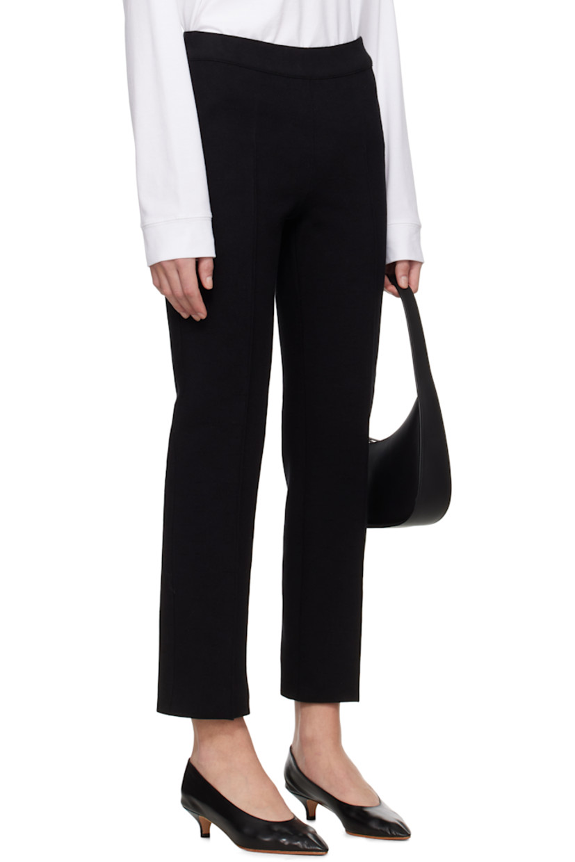 Knit stretch cotton-blend trousers. Jacquard check pattern throughout.

· Elasticized waistband
· Pinched seam at legs
· Mock welt pockets at back

Supplier color: Black