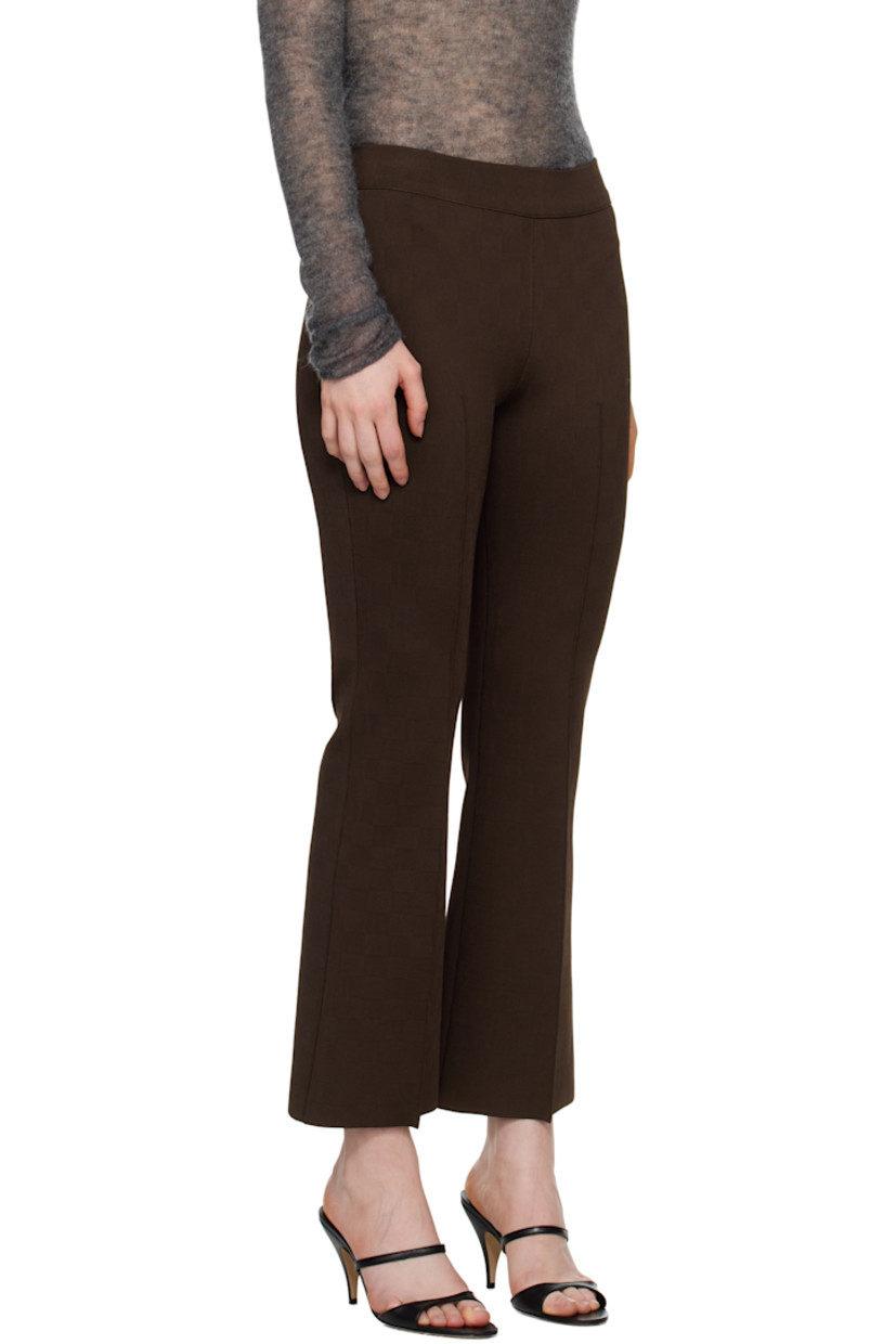 Flared knit stretch viscose-blend trousers. Subtle jacquard check pattern throughout.

· Elasticized waistband
· Cropped legs
· Pinched seams at front 
· Mock welt pockets at back

Supplier color: Chocolate