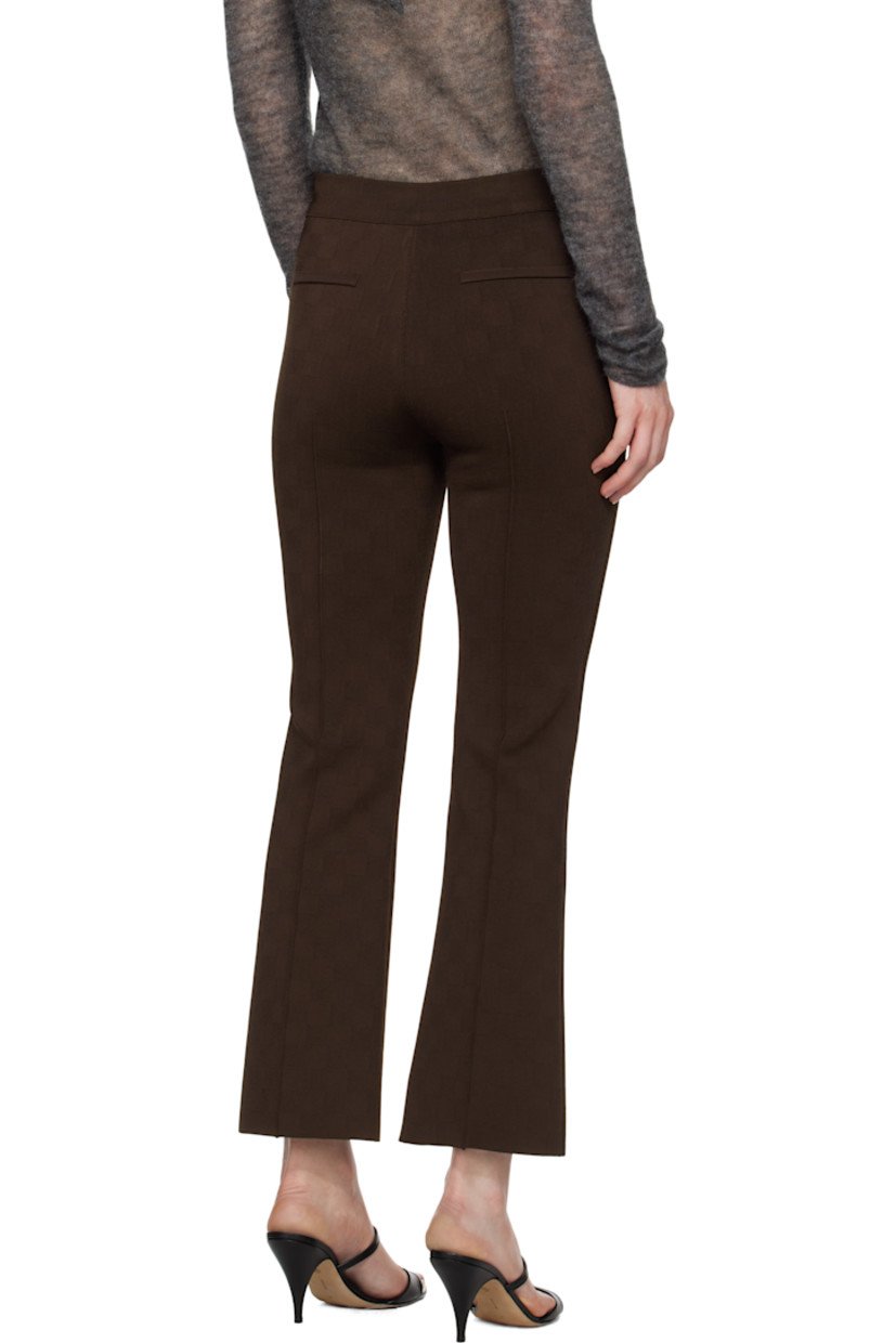 Flared knit stretch viscose-blend trousers. Subtle jacquard check pattern throughout.

· Elasticized waistband
· Cropped legs
· Pinched seams at front 
· Mock welt pockets at back

Supplier color: Chocolate