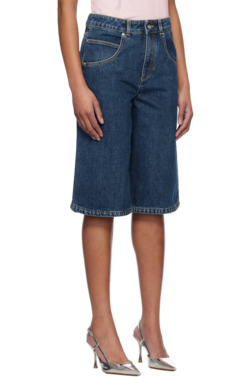 Non-stretch denim shorts. Fading throughout.

· Belt loops
· Five-pocket styling
· Zip fly
· Logo embroidered at leg
· Curved outseams
· Logo-engraved silver-tone hardware
· Contrast stitching in tan

Supplier color: Medium blue