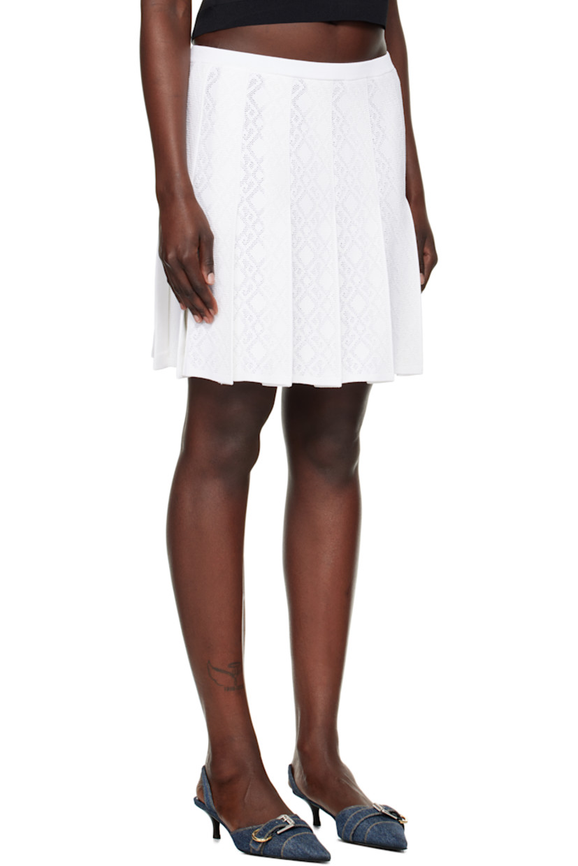 Semi-sheer pointelle-knit viscose- and nylon-blend miniskirt. Pleats and jacquard logo graphic pattern throughout.

· Elasticized waistband
· Rib-knit hem 

Supplier color: White