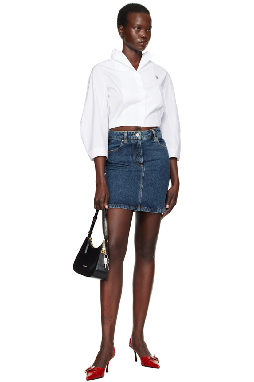 Non-stretch denim miniskirt. Fading throughout. 

· Belt loops
· Four-pocket styling
· Zip fly
· Logo-engraved silver-tone hardware
· Contrast stitching in tan

Supplier color: Medium blue