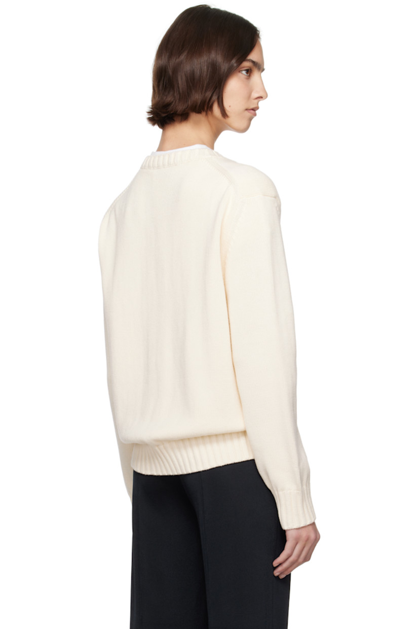 Oversized knit cotton sweater.

· Rib-knit crewneck, hem, and cuffs
· Logo embroidered at front
· Dropped shoulders

Supplier color: Ivory