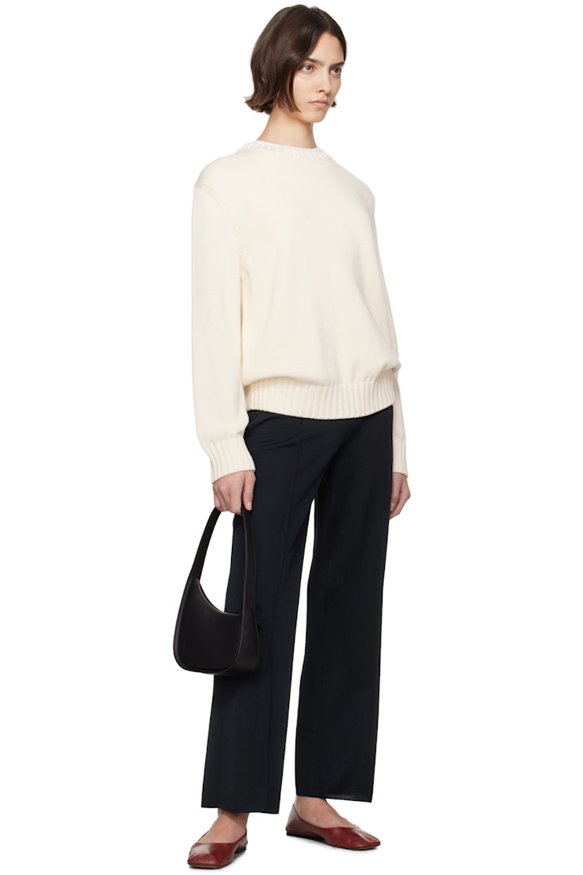Oversized knit cotton sweater.

· Rib-knit crewneck, hem, and cuffs
· Logo embroidered at front
· Dropped shoulders

Supplier color: Ivory