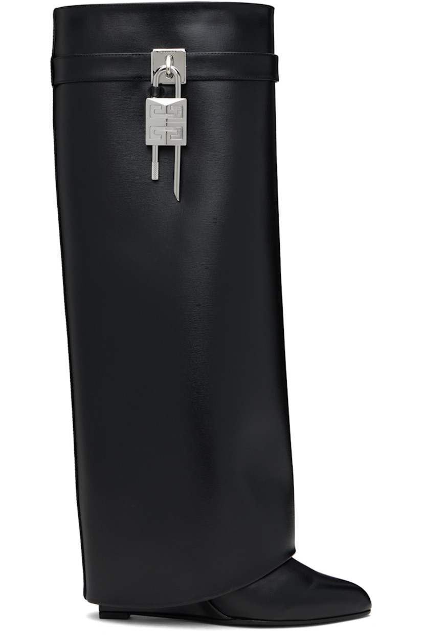 Knee-high grained calfskin slip-on boots in black.

· Layered construction
· Pointed toe
· Logo padlock at outer side
· Buffed goatskin lining
· Covered wedge heel with rubber injection
· Polished faux-leather sole
· Logo-engraved silver- and gold-tone hardware
· Heel: H3.5"

Supplier color: Black