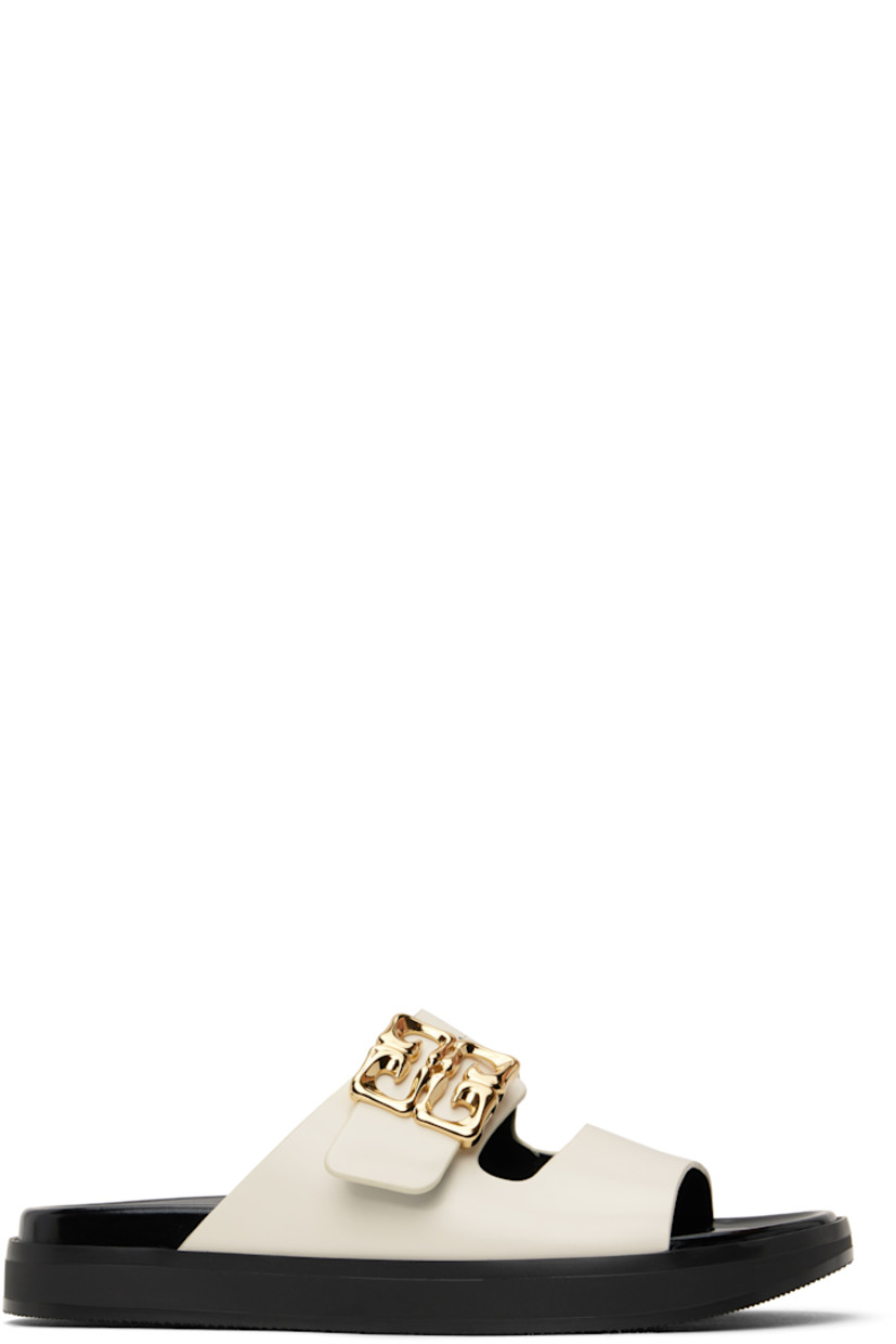 Patent calfskin flat sandals in off-white.

�· Open square toe
· Logo post-stud strap at vamp
· Logo stamp at polished leather footbed
· Grained leather lining
· Treaded rubber sole

Supplier color: Ivory