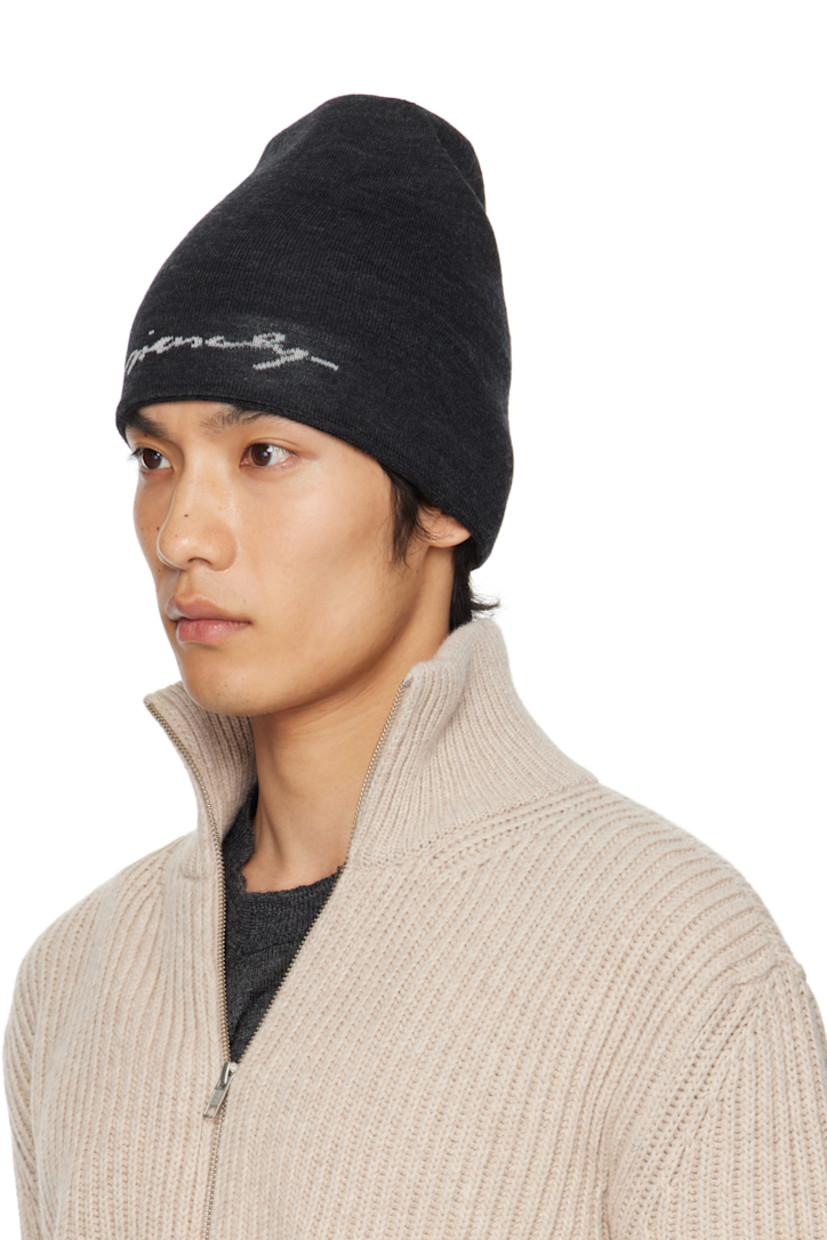 Reversible knit wool beanie. 

Reverse in gray knit wool. Jacquard logo pattern at face. 

· Jacquard logo at face 
· Rolled brim 

Supplier color: Charcoal/Light grey