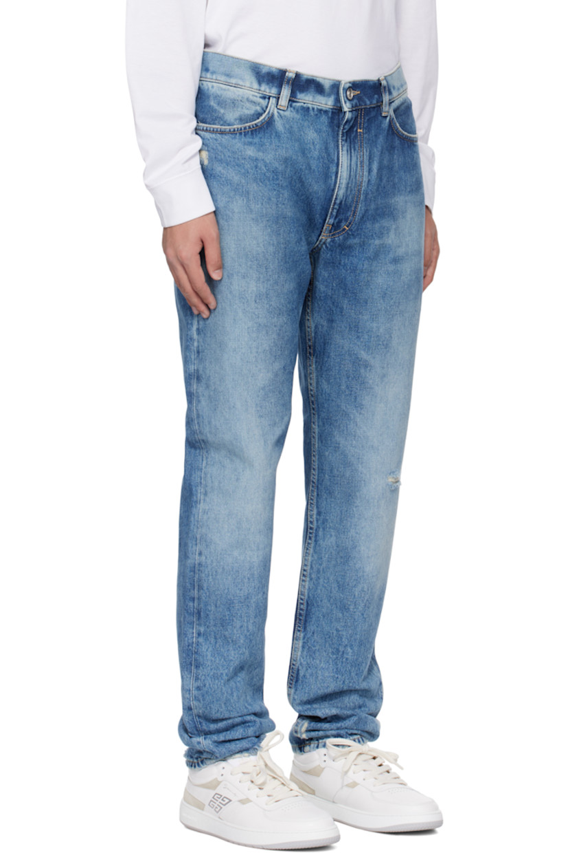 Slim-fit non-stretch denim jeans. Fading, whiskering, and distressing throughout. 

· Belt loops
· Four-pocket styling
· Zip-fly
· Logo embroidered at back waistband
· Logo-engraved silver-tone hardware
· Contrast stitching in tan

Supplier color: Ocean blue