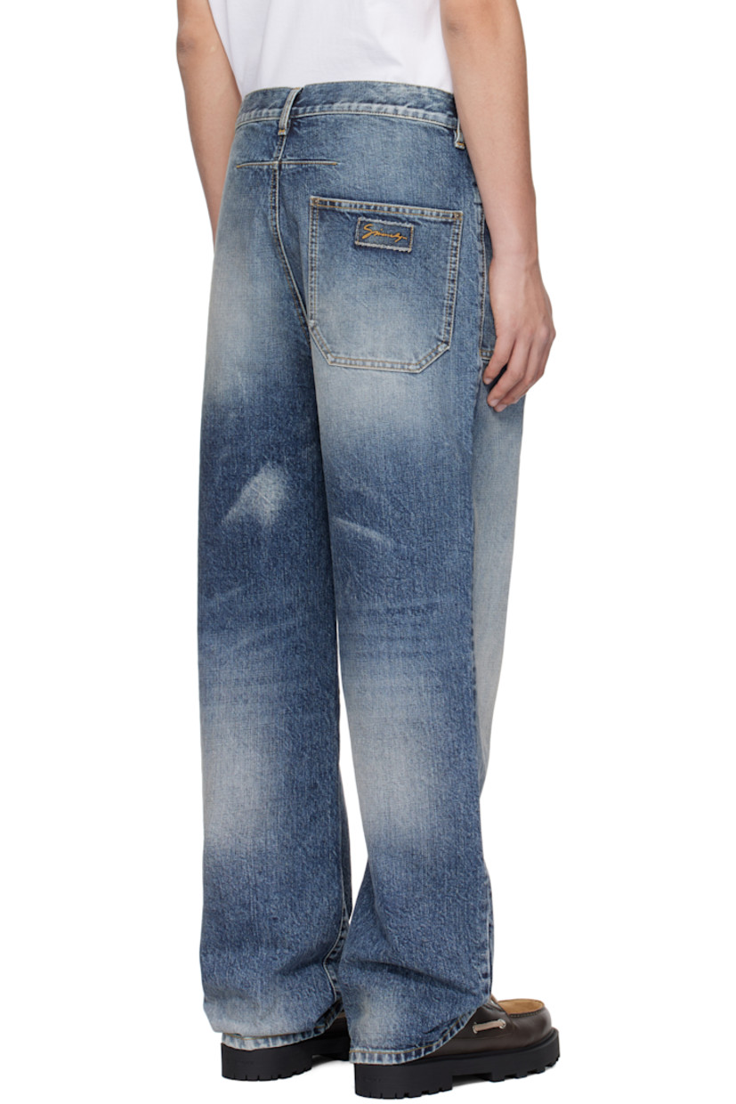 Loose-fit non-stretch denim jeans. Fading and whiskering throughout. 

· Belt loops
· Three-pocket styling
· Zip-fly
· Darts at back
· Logo patch at back pocket
· Logo-engraved bronze-tone hardware
· Contrast stitching in yellow

Supplier color: Light blue