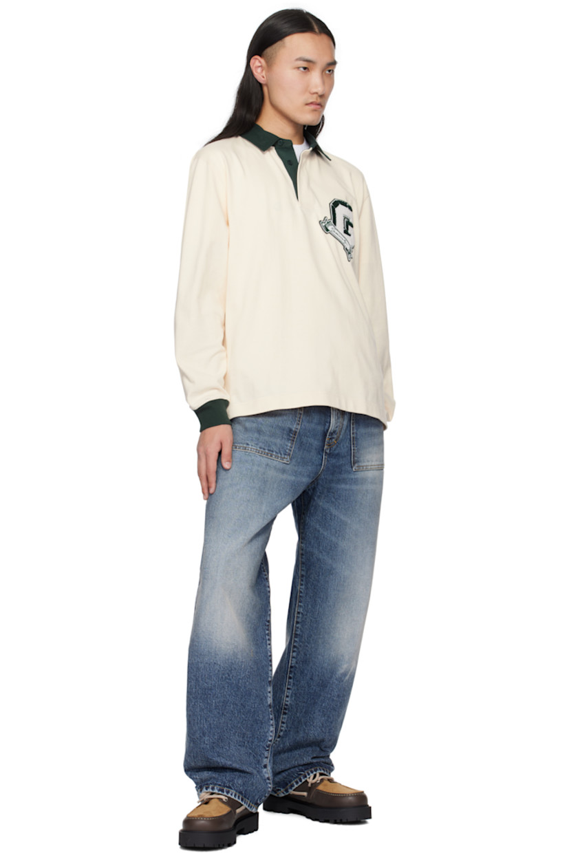 Loose-fit non-stretch denim jeans. Fading and whiskering throughout. 

· Belt loops
· Three-pocket styling
· Zip-fly
· Darts at back
· Logo patch at back pocket
· Logo-engraved bronze-tone hardware
· Contrast stitching in yellow

Supplier color: Light blue