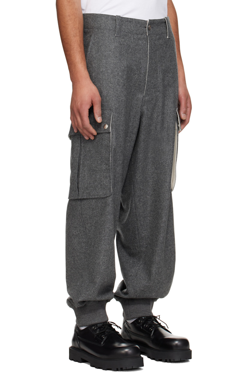 Wool felt cargo pants.

· Belt loops
· Four-pocket styling
· Zip fly
· Rib-knit cuffs
· Cargo pocket at outseams
· Darts at back waistband
· Logo-engraved silver-tone hardware

Supplier color: Medium grey