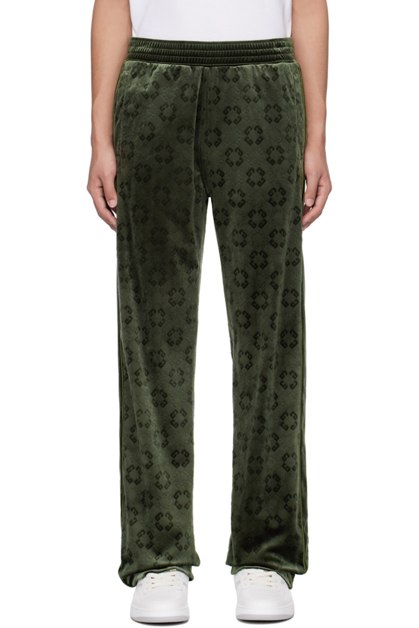 Relaxed-fit triacetate-blend velvet sweatpants. Logo pattern embossed throughout. 

· Paneled construction 
· Concealed drawstring at elasticized waistband 
· Three-pocket styling 
· Piping at outseams

Supplier color: Green