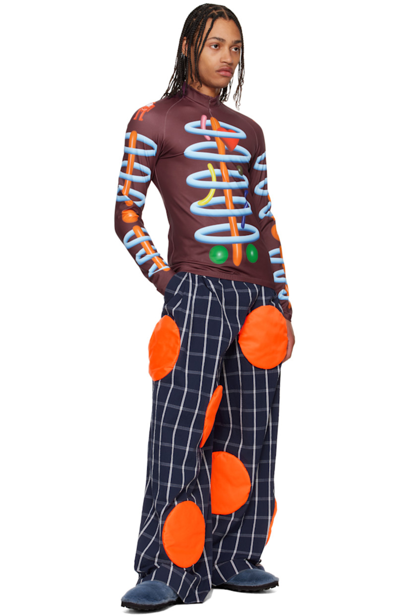 Stretch cotton-blend seersucker trousers. Check pattern and padded circular appliqués throughout.

· Belt loops
· Three-pocket styling
· Zip fly
· Pleats at front

Supplier color: Navy