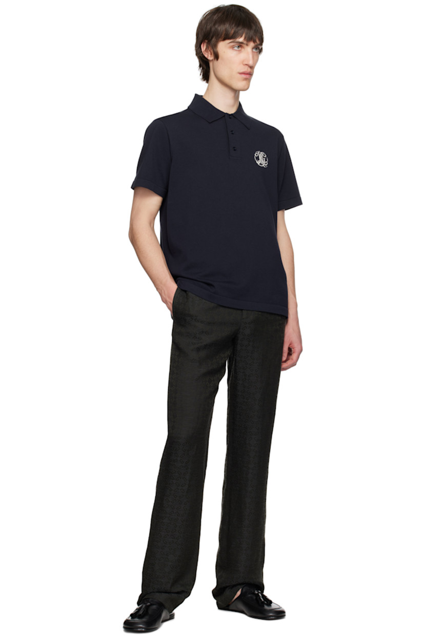 Plain-woven acetate- and linen-blend trousers. Jacquard logo pattern throughout.

· Belt loops
· Four-pocket styling
· Zip fly
· Partial cupro satin lining

Supplier color: Dark grey