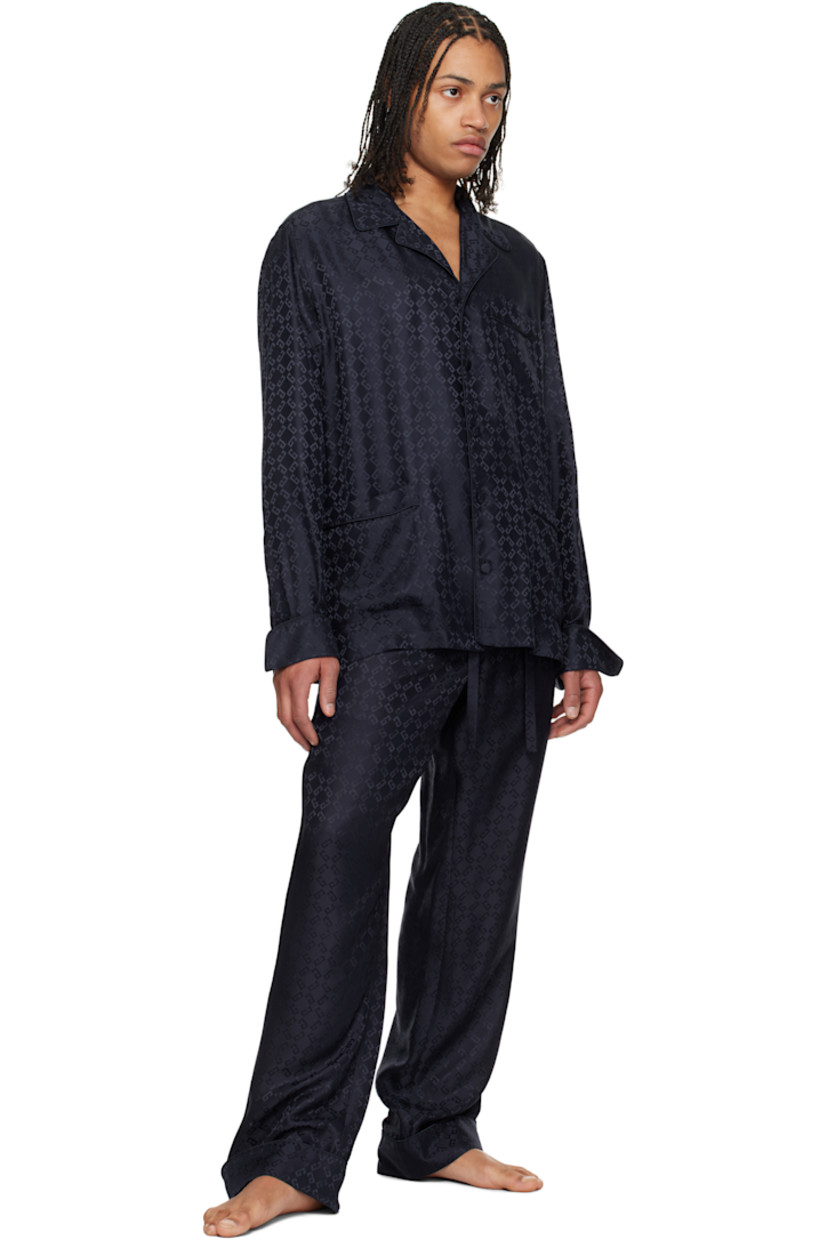 Loose-fit silk poplin pyjama shirt. Piping and jacquard logo pattern throughout.

· Open spread collar
· Button closure
· Patch pockets
· Vented side seams
· Dropped shoulders
· Pleats at single-button barrel cuffs
· Twin pleats at back yoke

Supplier color: Dark blue