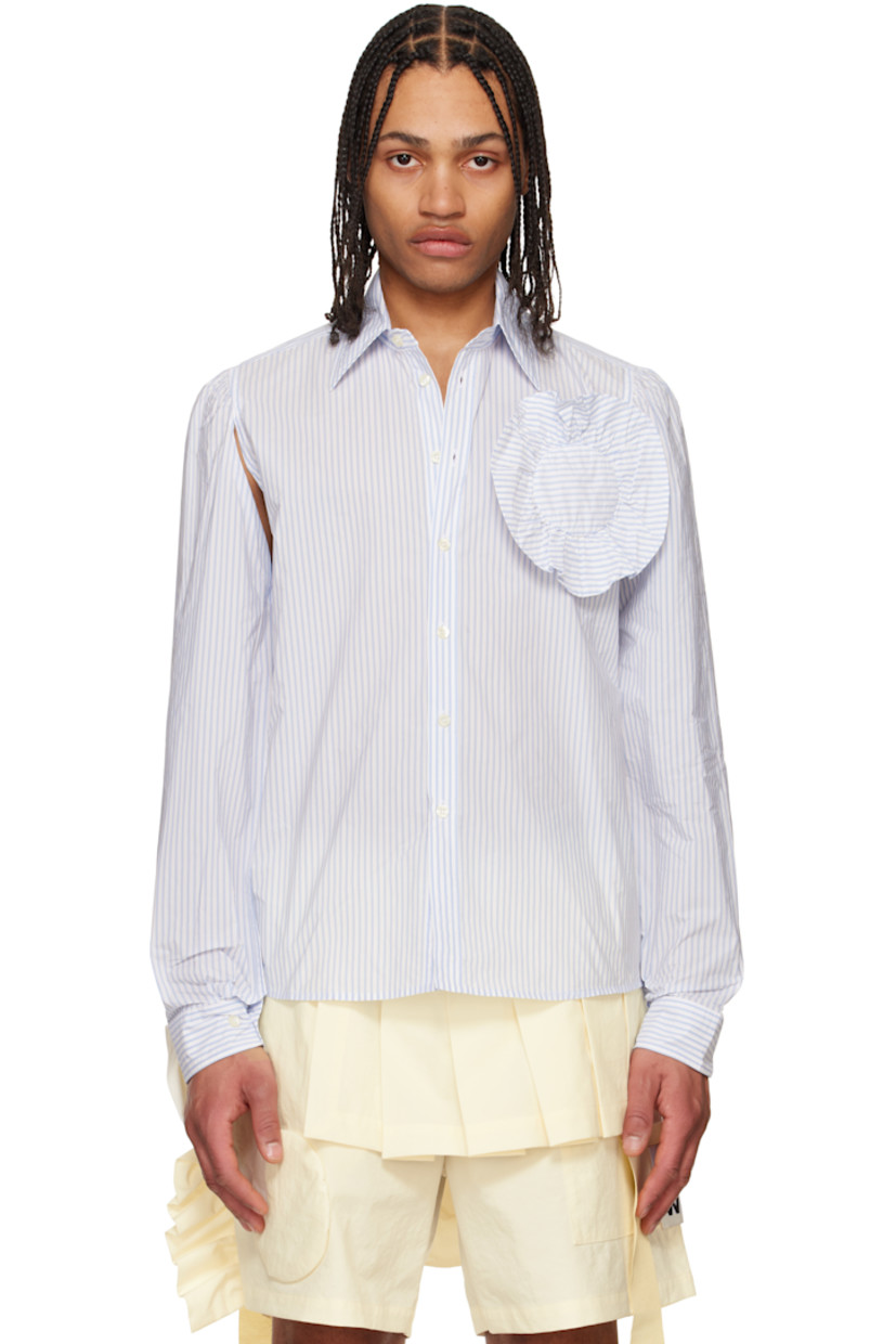 Nylon-blend taffeta shirt. Slit with button fastening at underarms for alternate styling.

· Stripes throughout
· Spread collar
· Button closure
· Floral appliqué at chest
· Shirttail hem
· Gathering at shoulders
· Pleated buttoned barrel cuffs
· Locker loop at back yoke
· Mother-of-pearl hardware

Supplier color: Off-White