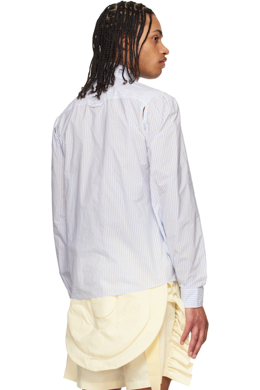 Nylon-blend taffeta shirt. Slit with button fastening at underarms for alternate styling.

· Stripes throughout
· Spread collar
· Button closure
· Floral appliqué at chest
· Shirttail hem
· Gathering at shoulders
· Pleated buttoned barrel cuffs
· Locker loop at back yoke
· Mother-of-pearl hardware

Supplier color: Off-White