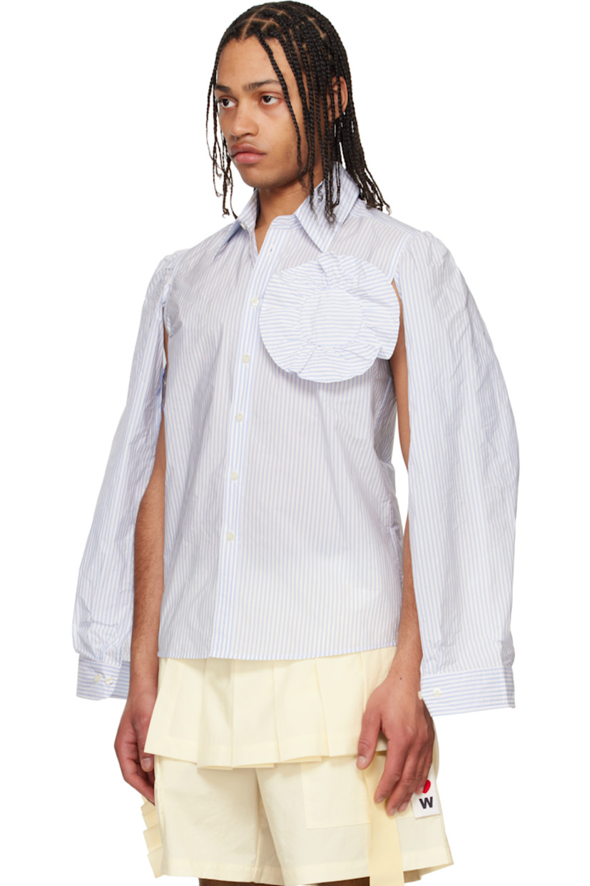 Nylon-blend taffeta shirt. Slit with button fastening at underarms for alternate styling.

· Stripes throughout
· Spread collar
· Button closure
· Floral appliqué at chest
· Shirttail hem
· Gathering at shoulders
· Pleated buttoned barrel cuffs
· Locker loop at back yoke
· Mother-of-pearl hardware

Supplier color: Off-White