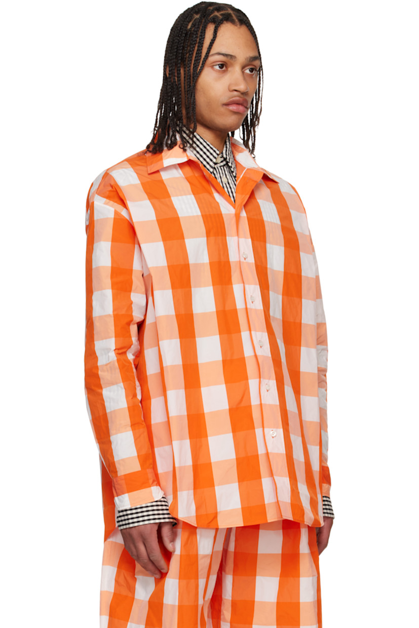 Polyester- and nylon-blend taffeta shirt. Check pattern throughout.

· Spread collar
· Button closure
· Shirttail hem
· Pleats at buttoned barrel cuffs
· Mother-of-pearl hardware

Supplier color: Orange