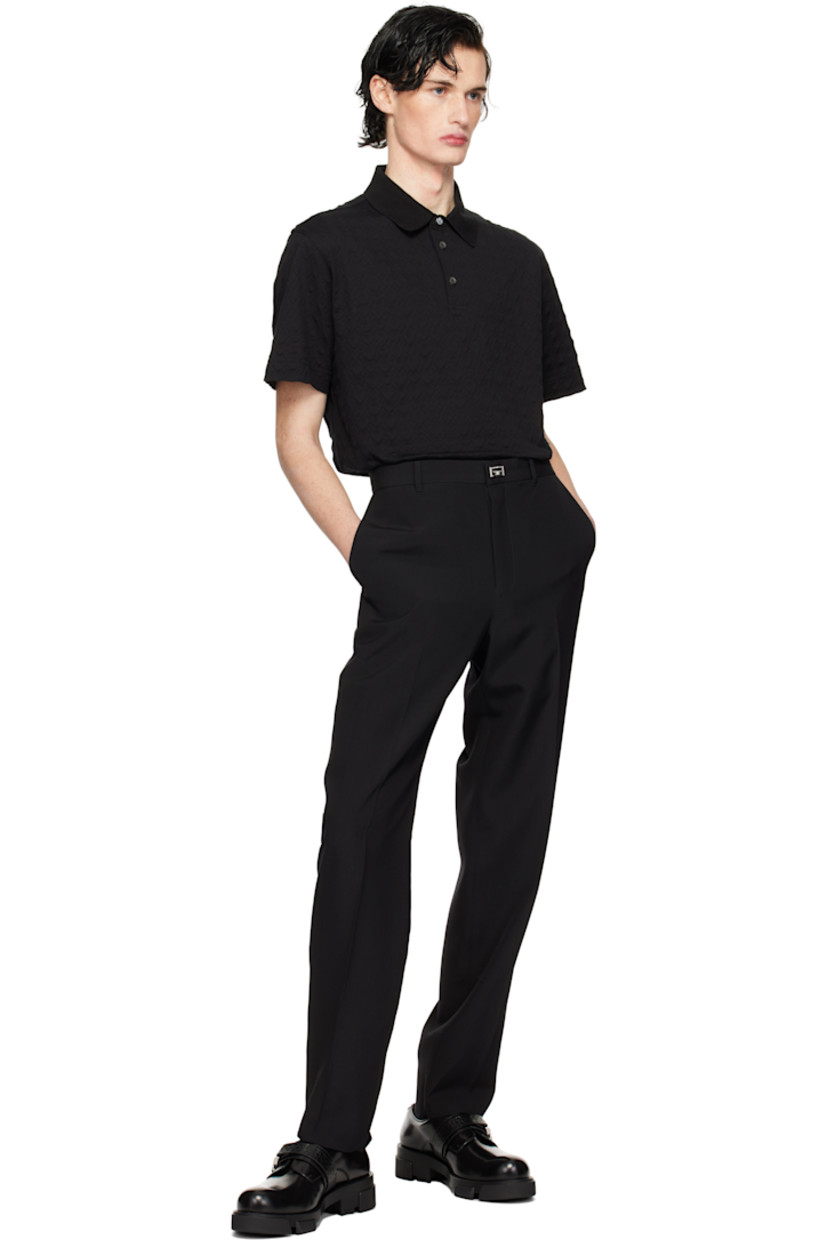 Cotton piqué polo. Jacquard logo pattern throughout. 

· Rib-knit spread collar
· Three-button placket
· Tennis-tail hem

Supplier color: Black