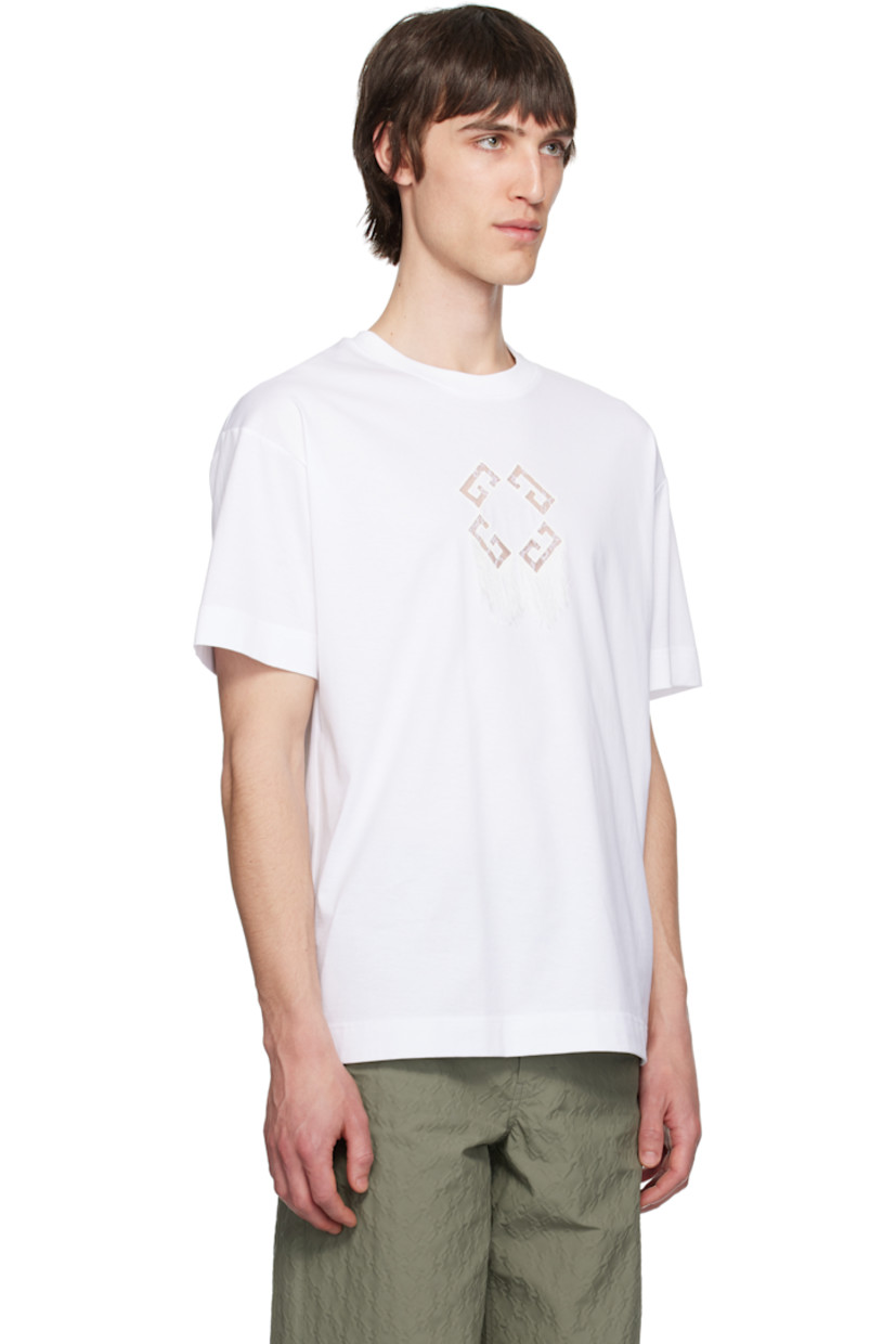 Cotton jersey T-shirt.

· Rib-knit crewneck
· Embroidered logo with lace and fringed detailing at chest
· Dropped shoulders

Supplier color: White