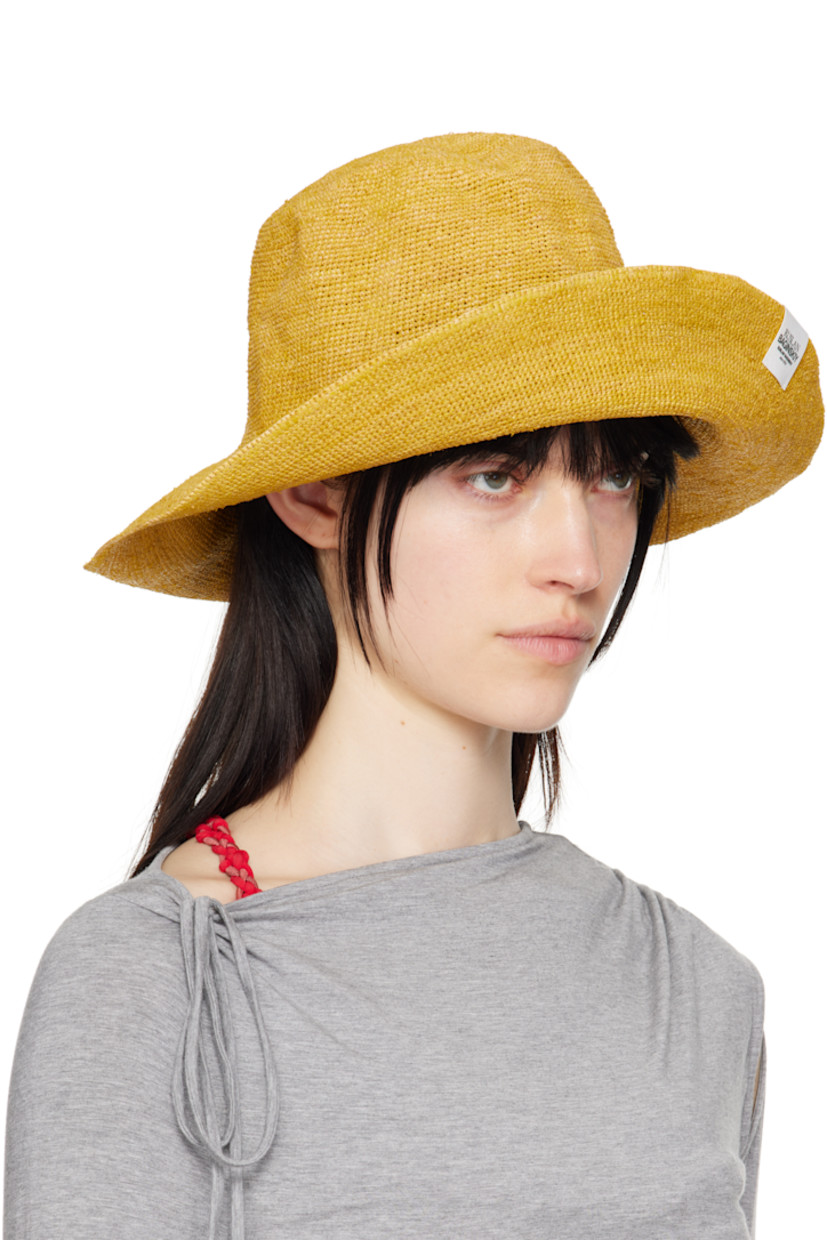 Woven straw bucket hat in yellow. 

· Logo flag at brim
· Unlined

Supplier color: Yellow