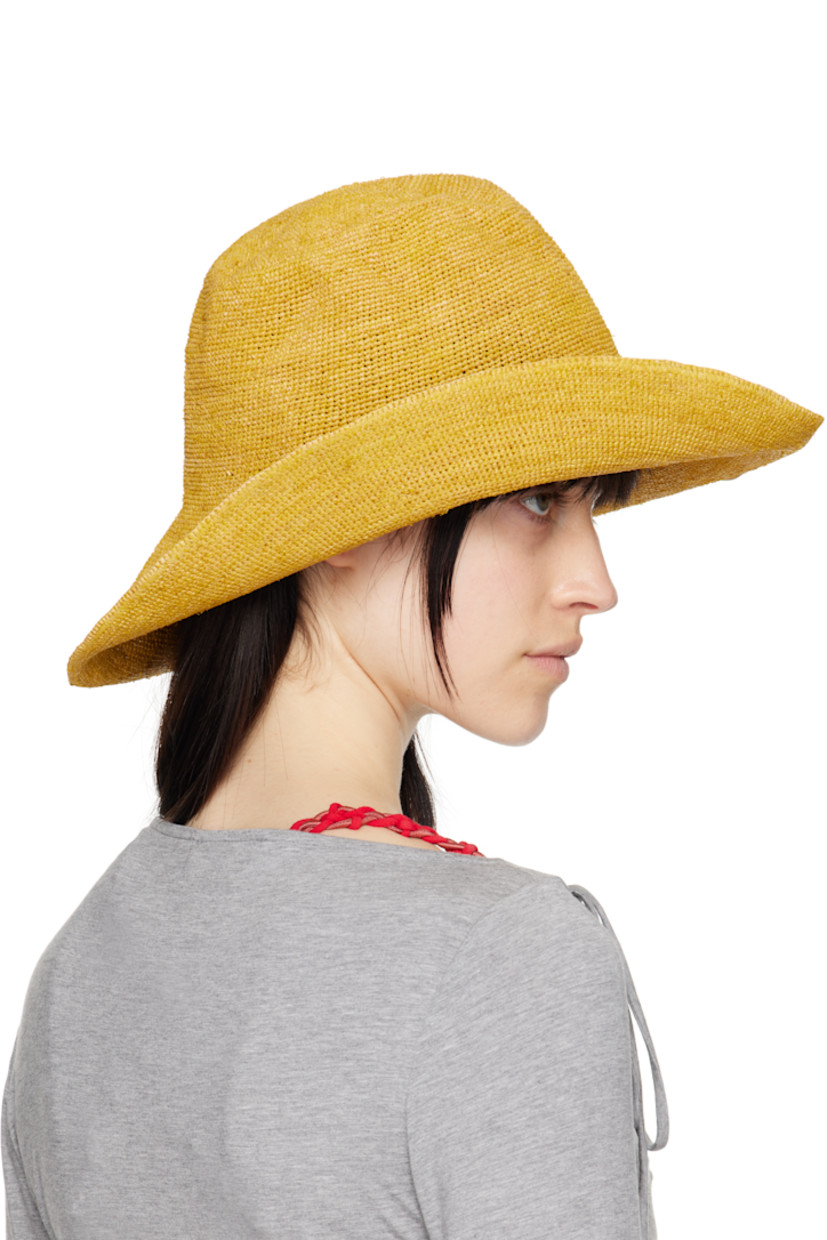 Woven straw bucket hat in yellow. 

· Logo flag at brim
· Unlined

Supplier color: Yellow
