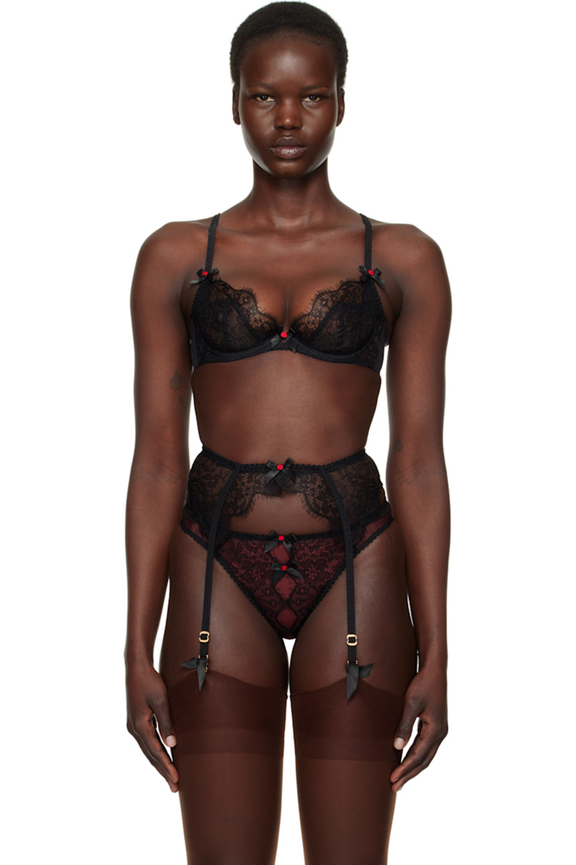Semi-sheer nylon-blend lace and stretch nylon mesh bra. Scalloped edges and jacquard floral pattern throughout.

· Bow appliqués at front
· Underwire at cups
· Adjustable elasticized spaghetti straps
· Adjustable hook-eye fastening at back

Supplier color: Black