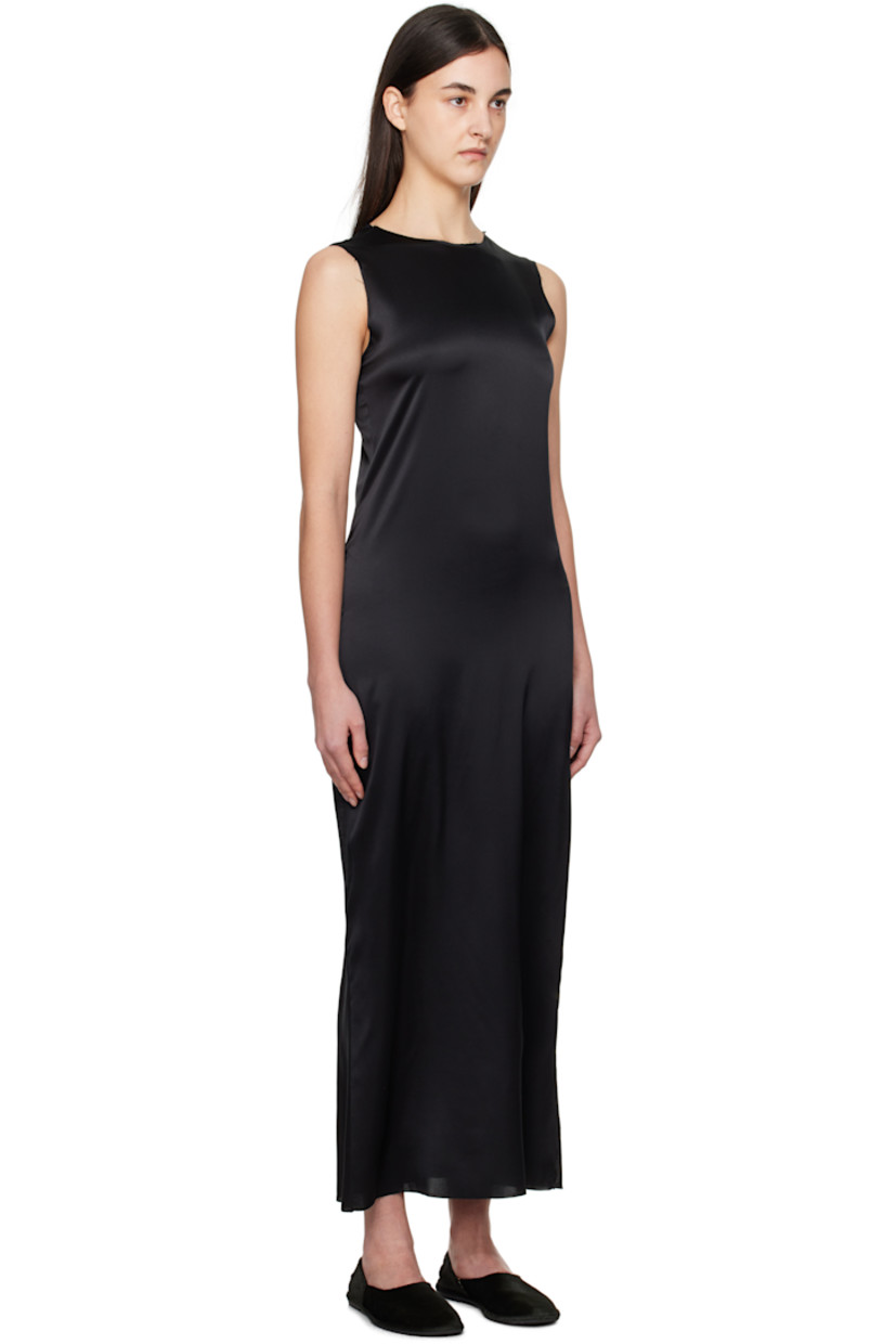 Handcrafted stretch silk satin maxi dress. 

· Raw edge at round neck, hem, and armscyes
· Slit at side seam
· Vent at back collar

Supplier color: Black