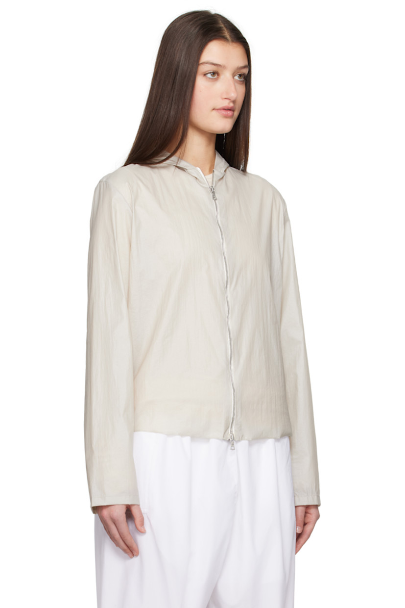 Handcrafted coated nylon taffeta jacket. 

· Hood at collar
· Two-way zip closure
· Unlined

Supplier color: Stone