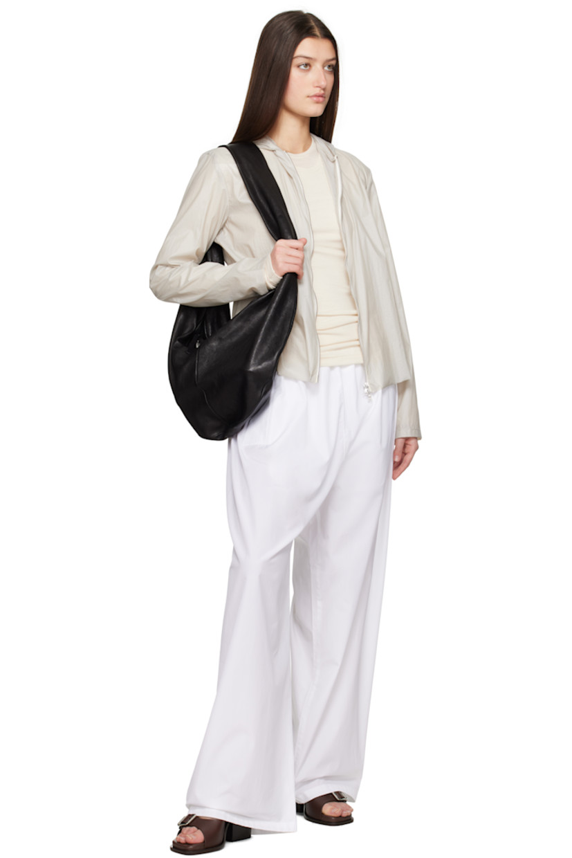Handcrafted coated nylon taffeta jacket. 

· Hood at collar
· Two-way zip closure
· Unlined

Supplier color: Stone