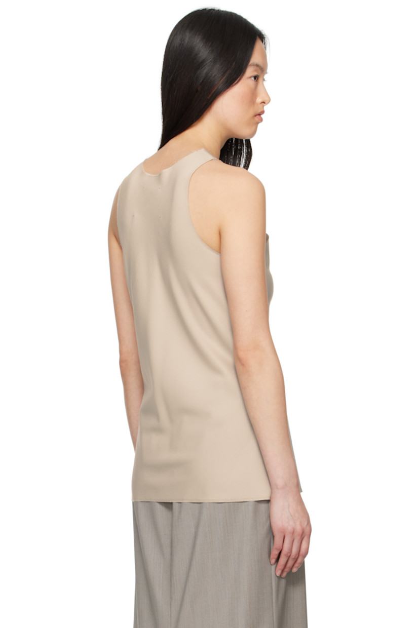Plain-woven tank top. 

· Loro Piana superfine merino wool
· Raw edge at crewneck, hem, and armscyes.

Supplier color: Beige