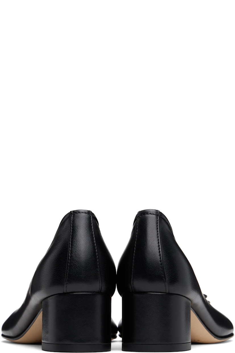 Handcrafted grained nappa leather heels in black 

· Hand-painted edges throughout 
· Bow accent at vamp
· Logo stamp at padded leather footbed
· Suede lining
· Covered block heel with rubber injection
· Nubuck sole
· Heel: H1.75"

Supplier color: Black