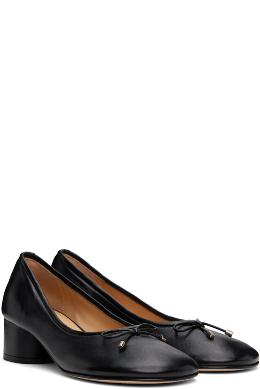 Handcrafted grained nappa leather heels in black 

· Hand-painted edges throughout 
· Bow accent at vamp
· Logo stamp at padded leather footbed
· Suede lining
· Covered block heel with rubber injection
· Nubuck sole
· Heel: H1.75"

Supplier color: Black