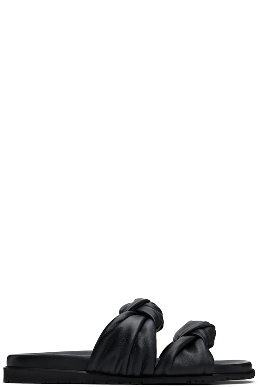 Handcrafted grained leather flat sandals in black.

· Open toe
· Straps with knotted detailing at vamp
· Logo stamp at molded footbed
· Treaded rubber sole

Supplier color: Black