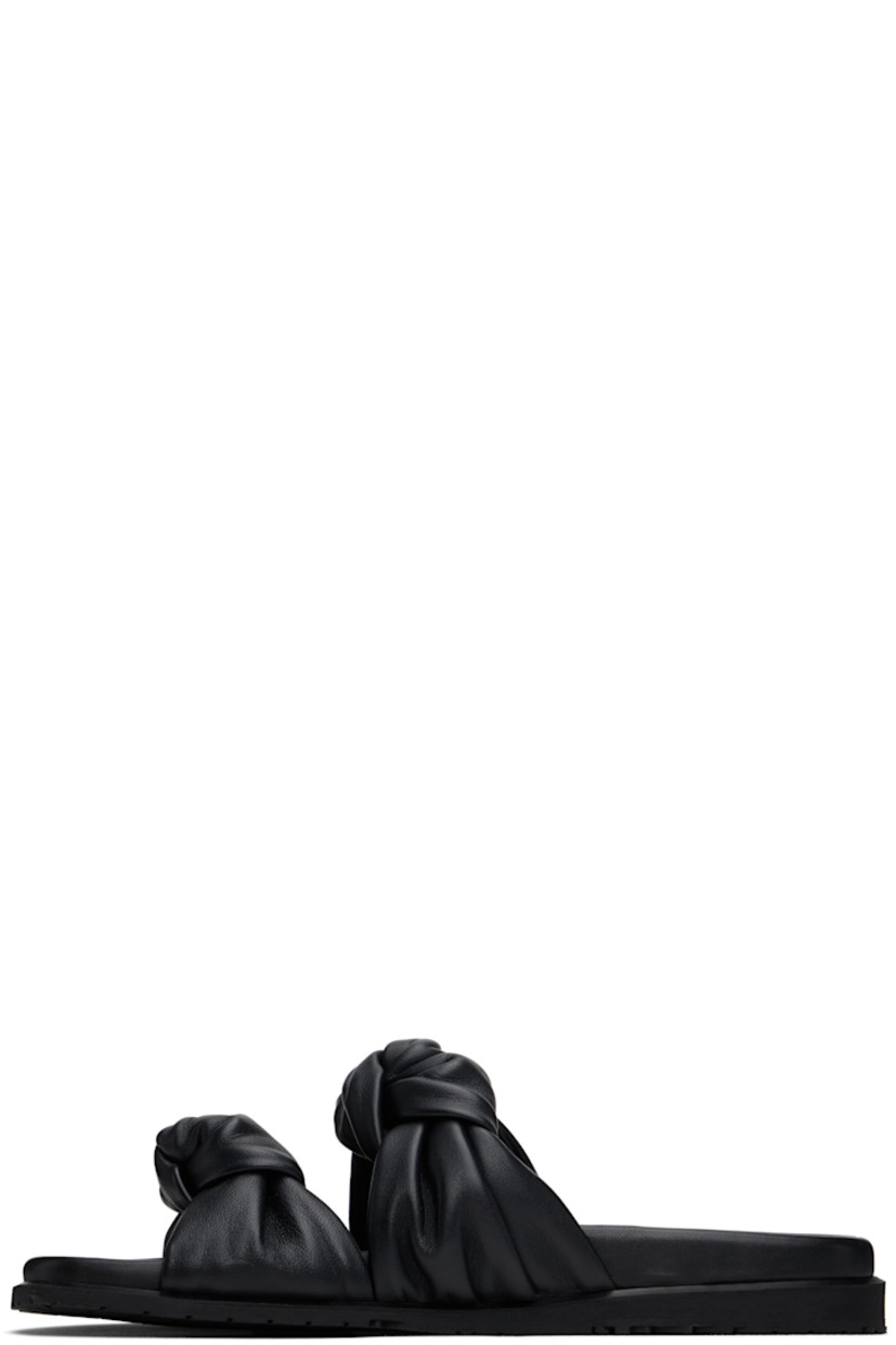 Handcrafted grained leather flat sandals in black.

· Open toe
· Straps with knotted detailing at vamp
· Logo stamp at molded footbed
· Treaded rubber sole

Supplier color: Black