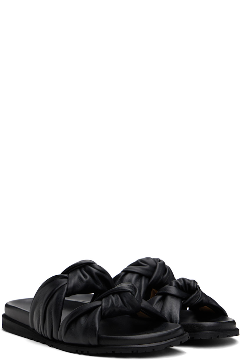 Handcrafted grained leather flat sandals in black.

· Open toe
· Straps with knotted detailing at vamp
· Logo stamp at molded footbed
· Treaded rubber sole

Supplier color: Black