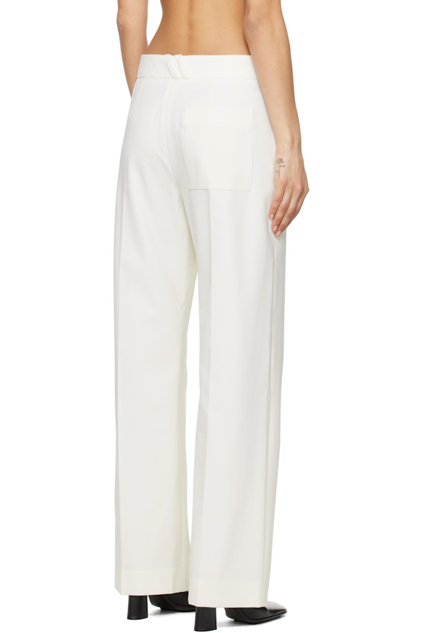 Straight-leg stretch virgin wool-blend gabardine trousers.

· Low-rise
· Three-pocket styling
· Zip-fly
· Buttoned fold-down panel at front
· Creased legs
· Belt loops and darts at back waistband 

Supplier color: Off white